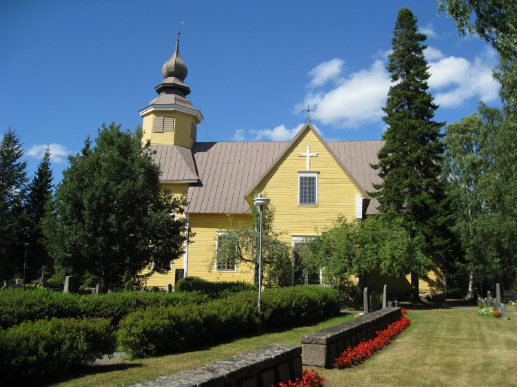 Puukirkko ja hautausmaata.